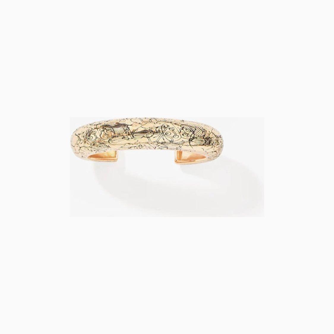 Enhance your wrist wear with the exquisite Aurélie Bidermann Rosalba cuff bracelet, crafted in 18k gold brass.&nbsp; The bracelet is decorated with flowers in brass, gilded with 750/1000 yellow gold.