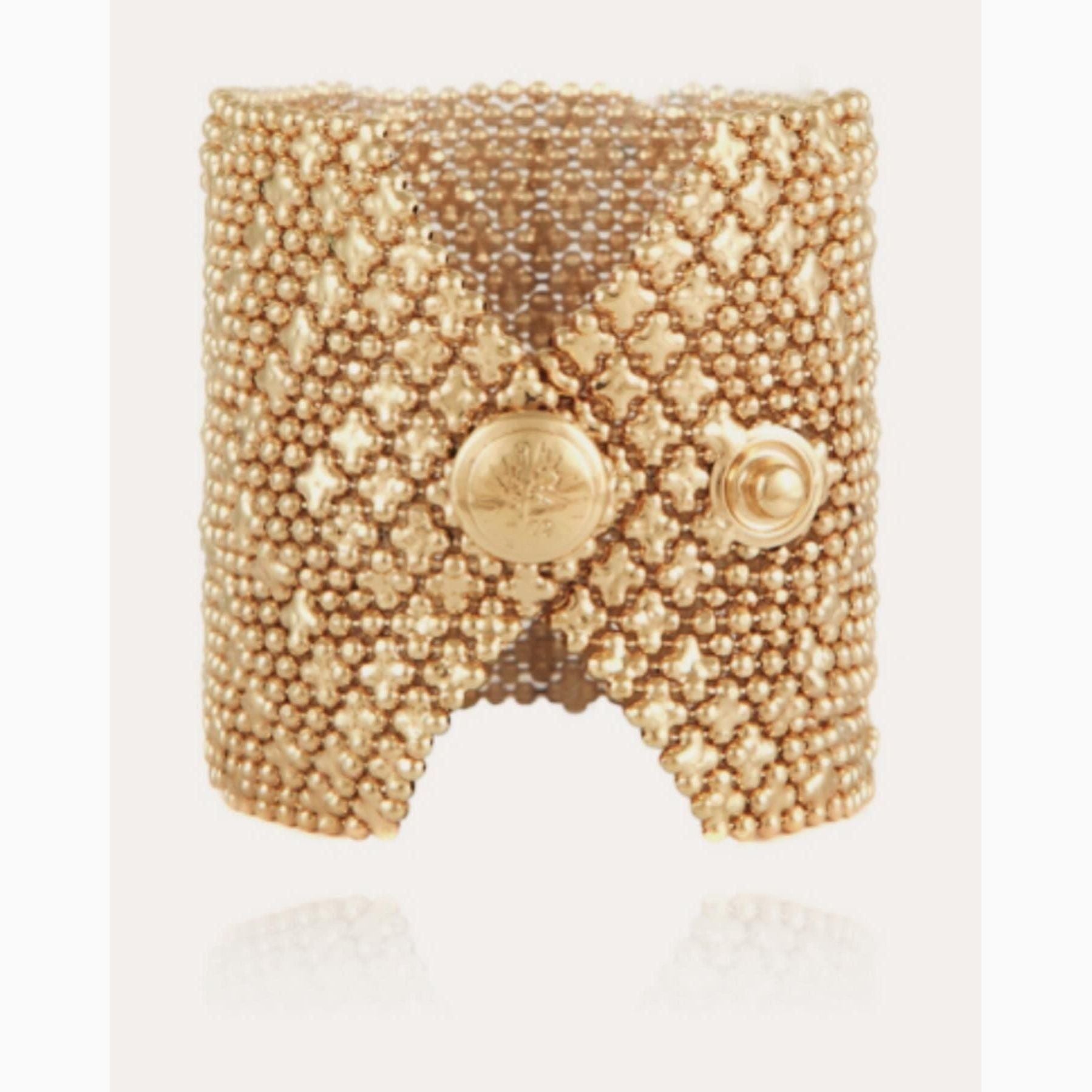 Introducing the stunning Gas Bijoux 24k gold-plated cuff, adorned with multiple chains and star-shaped accents.