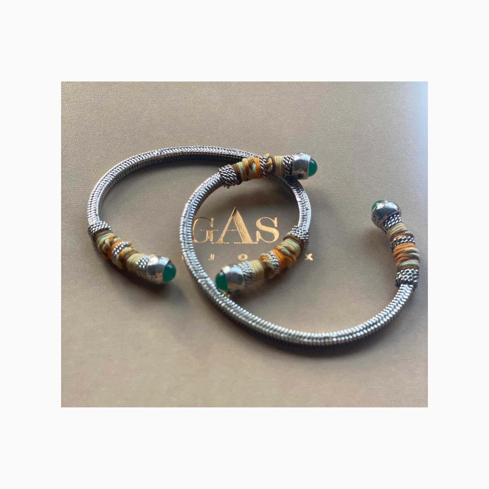This adjustable bangle offers both style and versatility, with a width of 0.7cms and a circumference of 16.5cms. Elevate your wrist with this exquisite piece, perfect for adding a touch of artisanal charm to any ensemble.