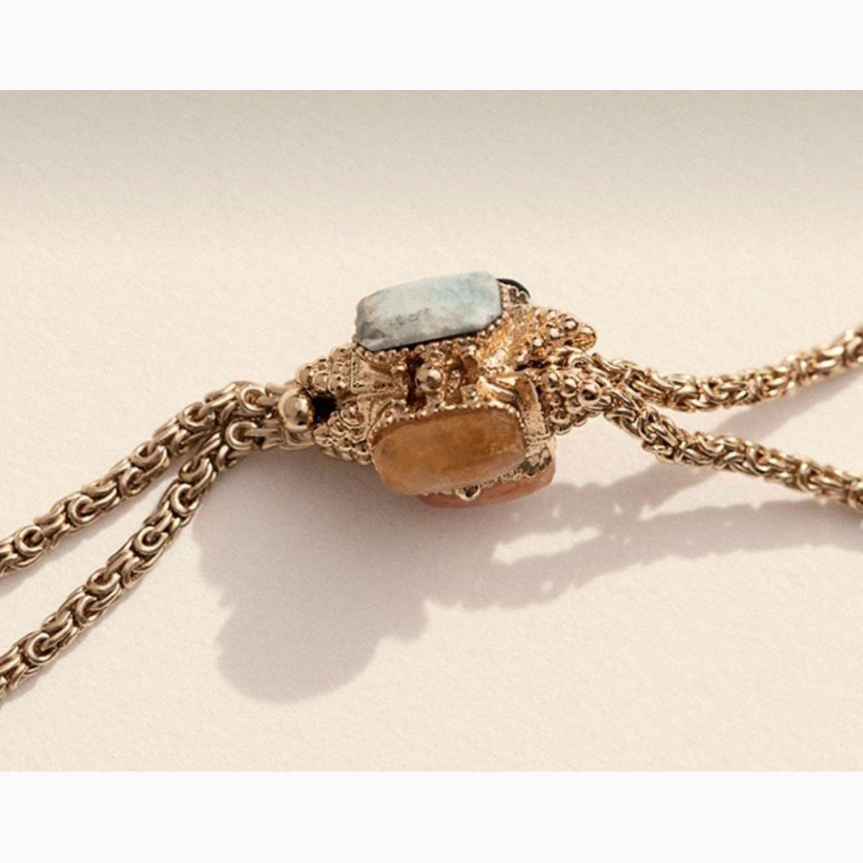 The Serti Talisman has a length of 36.5cms and a width of 1.5cms, it exudes elegance and sophistication.