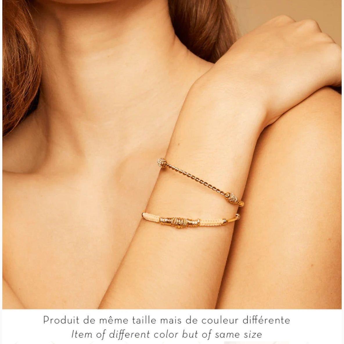 With a circumference of 15cms and a width of 0.4cms, this bangle is available in pink, green, and brown variants;