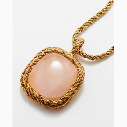 Featuring a stunning rose quartz pendant adorned with luxurious 18K gold plating, this necklace exudes timeless elegance.  With a length of 77.2cms and a pendant width of 2.7cms, it adds a touch of sophistication to any outfit. Indulge in the luxurious craftsmanship and captivating beauty of this statement piece from Aurélie Bidermann.