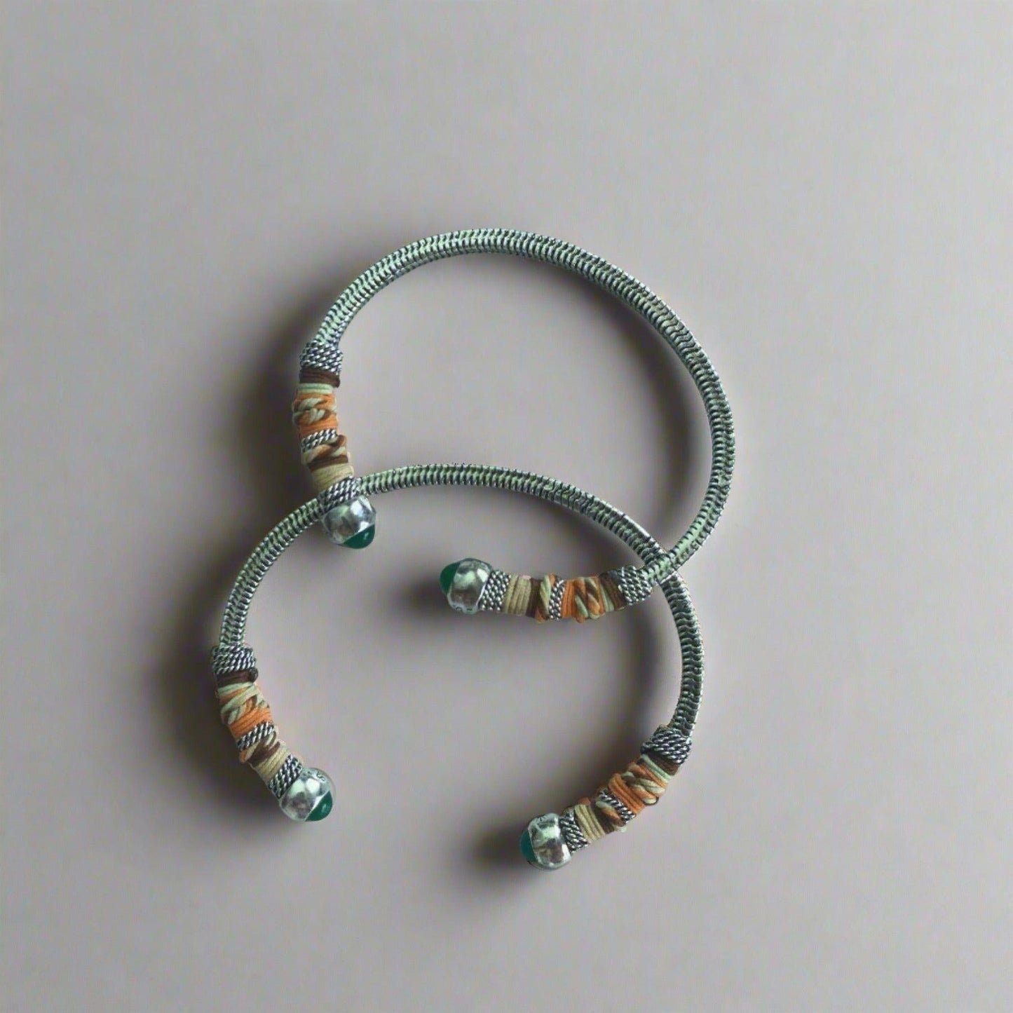 This adjustable bangle offers both style and versatility, with a width of 0.7cms and a circumference of 16.5cms. Elevate your wrist with this exquisite piece, perfect for adding a touch of artisanal charm to any ensemble.