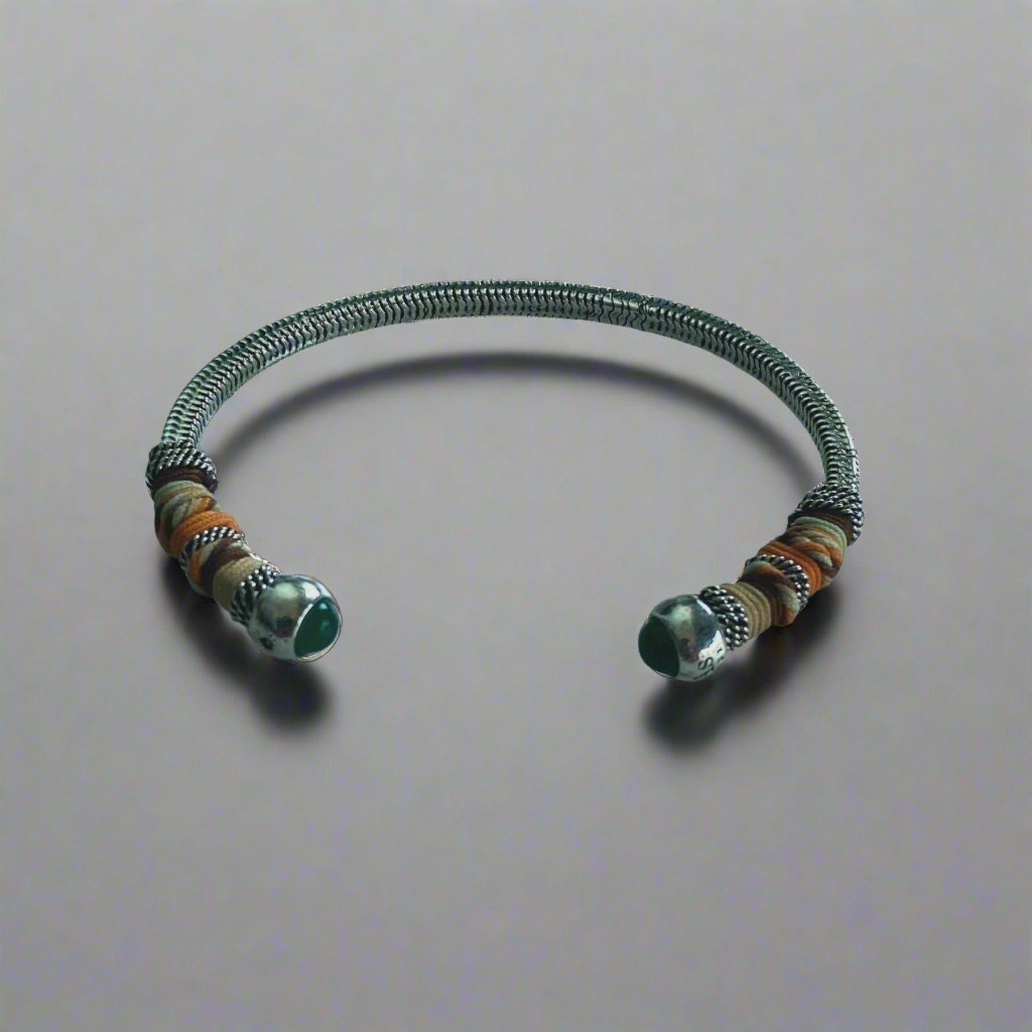 This adjustable bangle offers both style and versatility, with a width of 0.7cms and a circumference of 16.5cms. Elevate your wrist with this exquisite piece, perfect for adding a touch of artisanal charm to any ensemble.